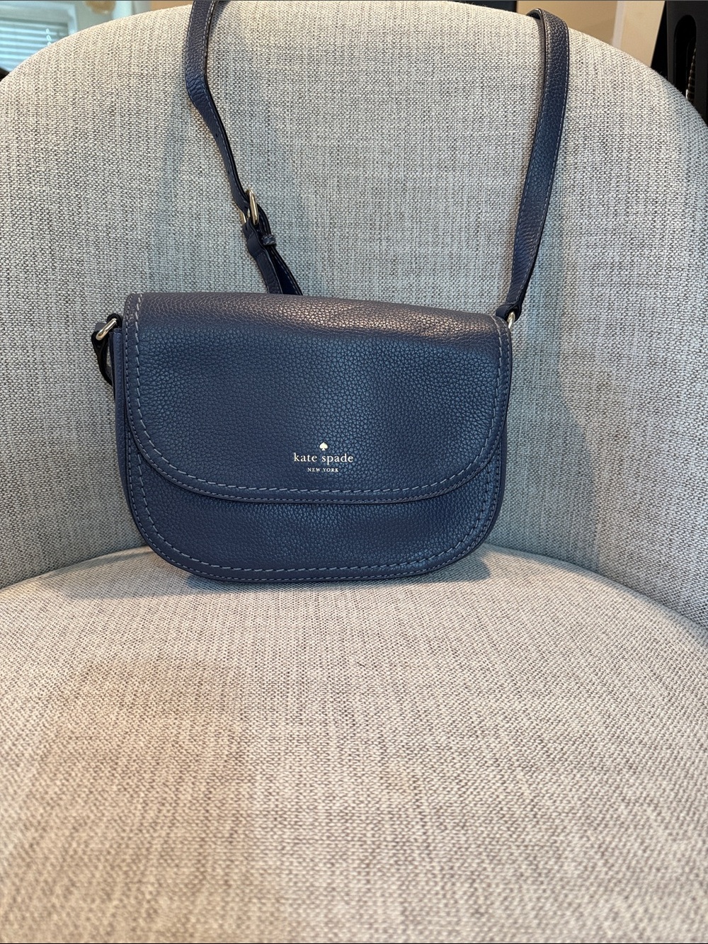 kate spade navy pebbled leather crossbody saddle bag with gold logo